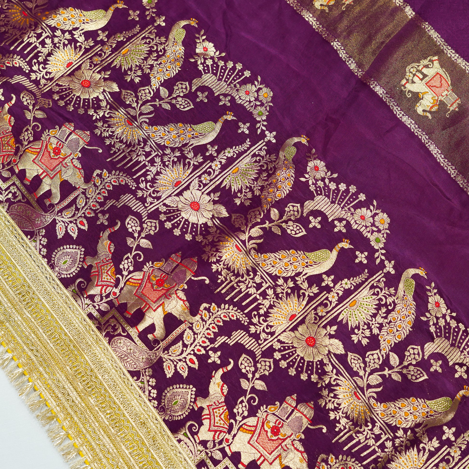 Wine purple dola silk saree with elephant motifs and heavy gota patti border