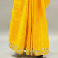 Yellow saree with intricate border on a white surface