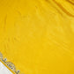 Yellow crepe saree with olive embroidery work and stitched blouse