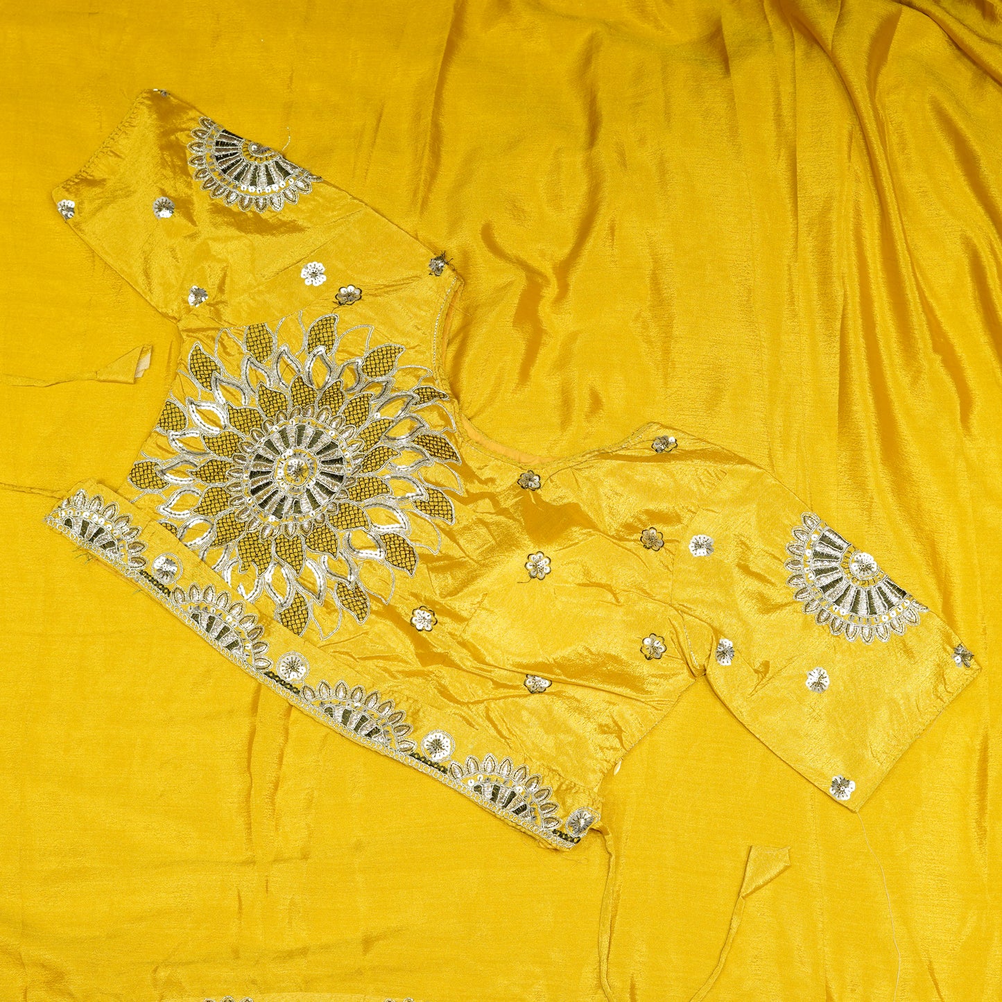 Yellow crepe saree with olive embroidery work and stitched blouse