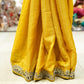 Yellow crepe saree with olive embroidery work and stitched blouse