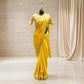 Yellow crepe saree with olive embroidery work and stitched blouse