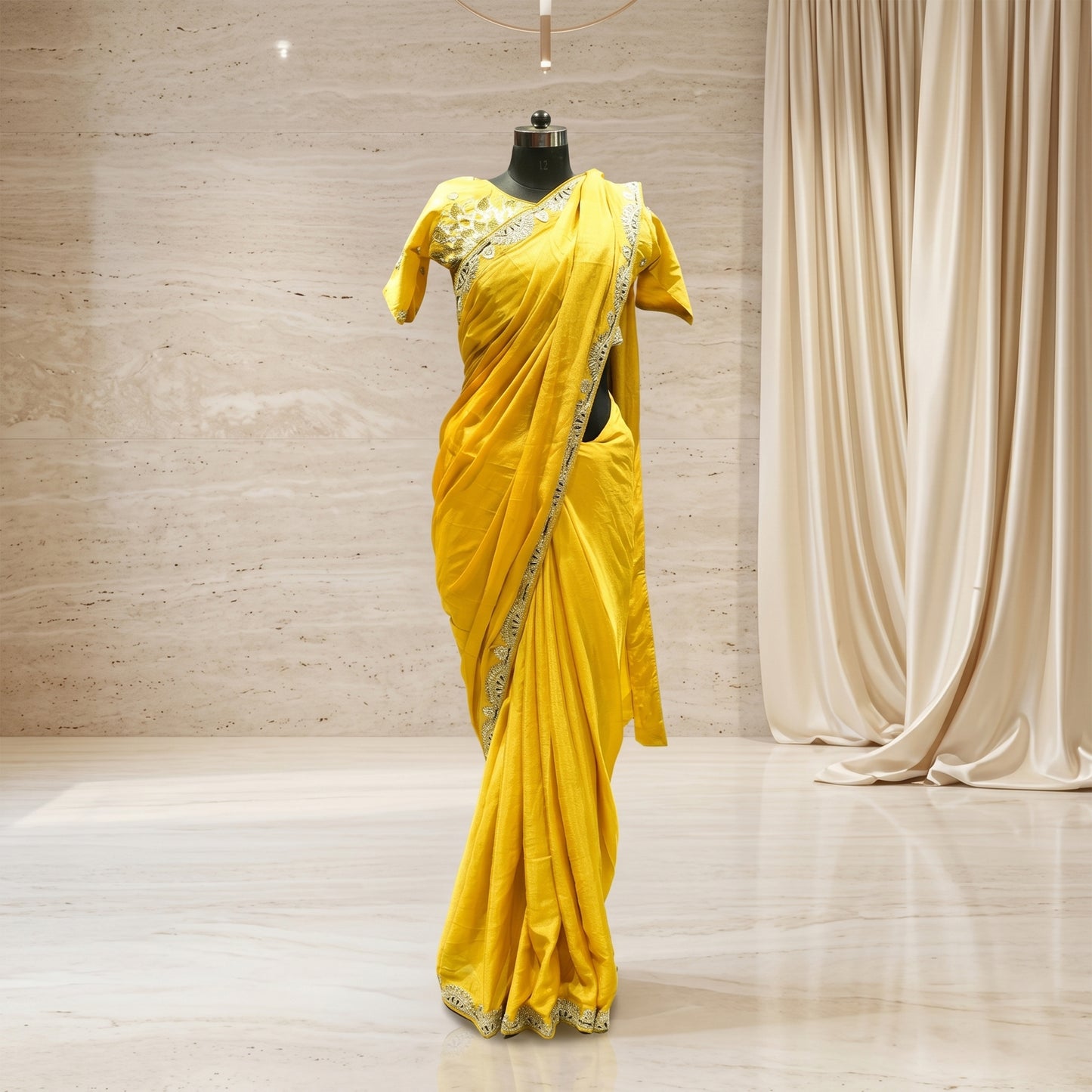 Yellow crepe saree with olive embroidery work and stitched blouse